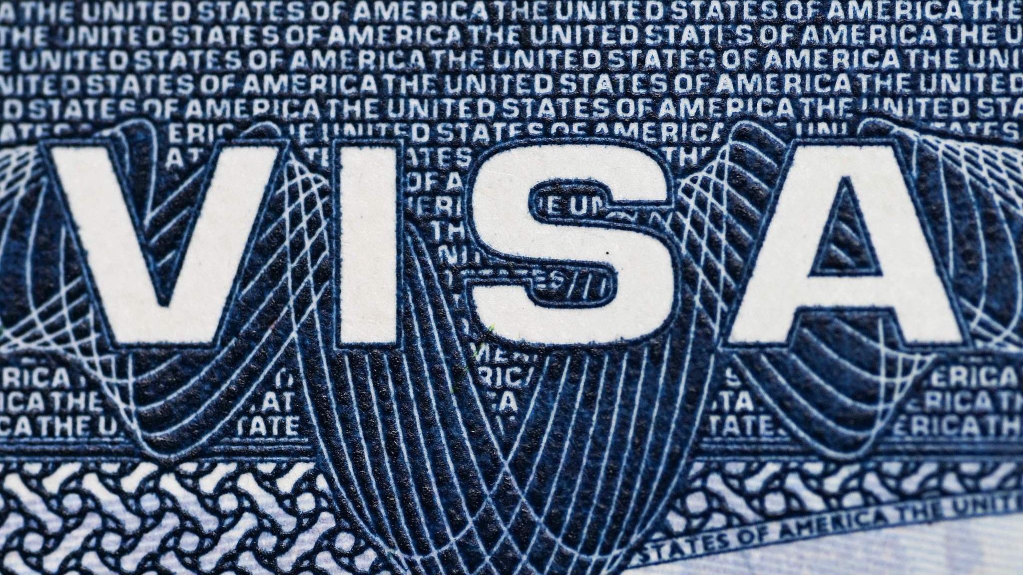 A US visa foil placed inside a passport. /VCG