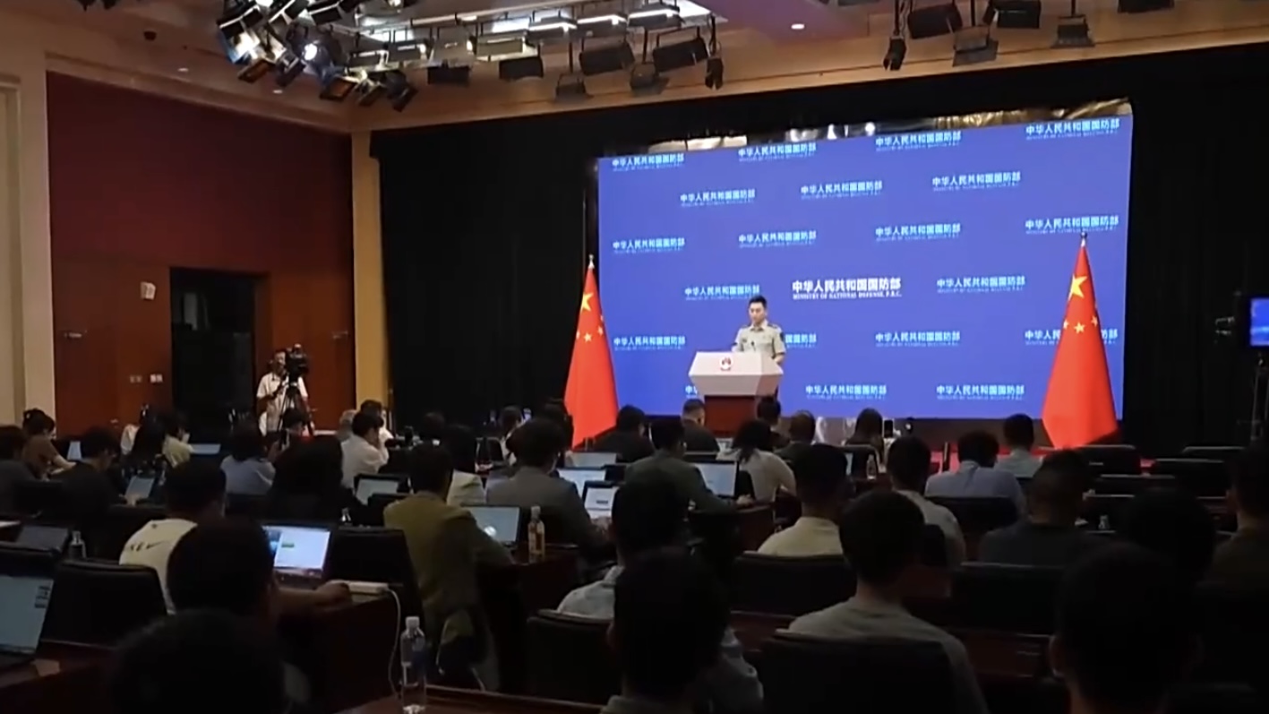 Chinese defense spokesperson Zhang Xiaogang answers questions at a press briefing, on August 27, 2026. /CMG