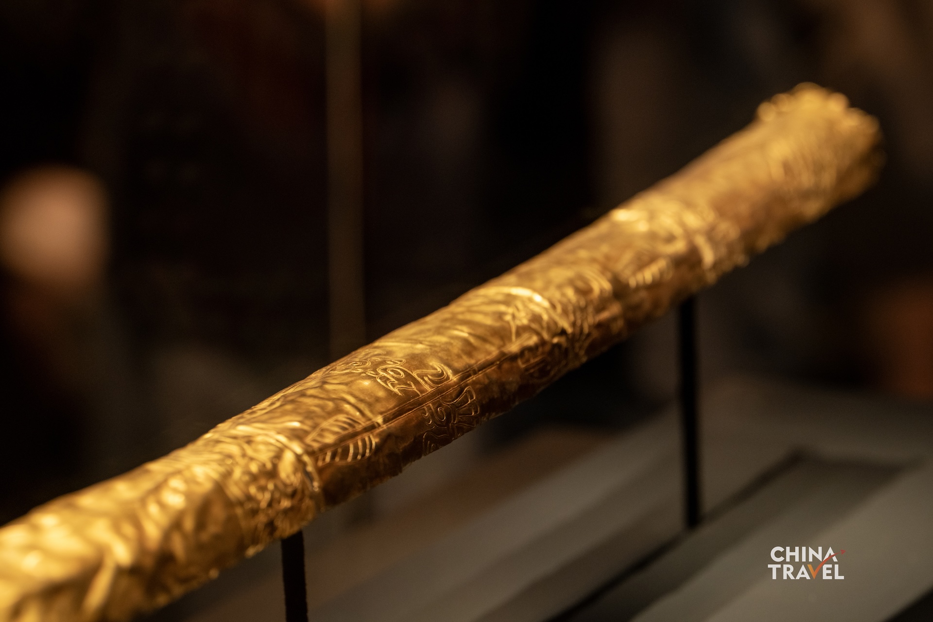 Sanxingdui's gold scepter is decorated with images of fish, birds, arrows and human figures. Its gold foil is believed to have once covered a wooden core. /CGTN