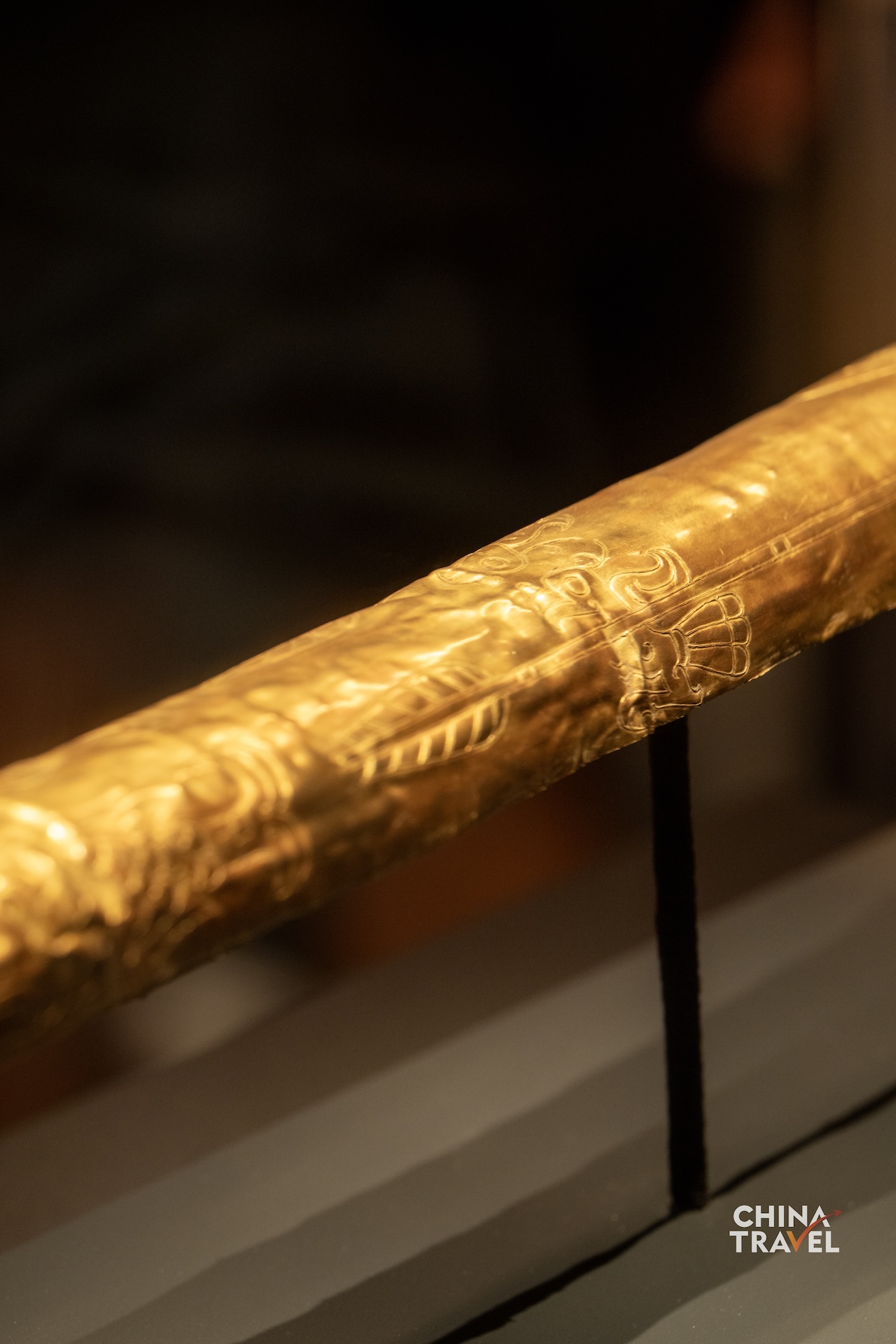 Sanxingdui's gold scepter is decorated with images of fish, birds, arrows and human figures. Its gold foil is believed to have once covered a wooden core. /CGTN