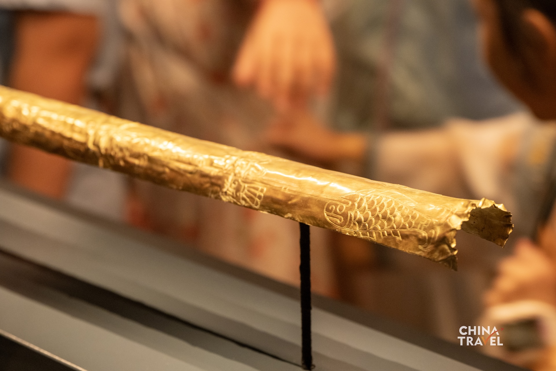 Sanxingdui's gold scepter is decorated with images of fish, birds, arrows and human figures. Its gold foil is believed to have once covered a wooden core. /CGTN