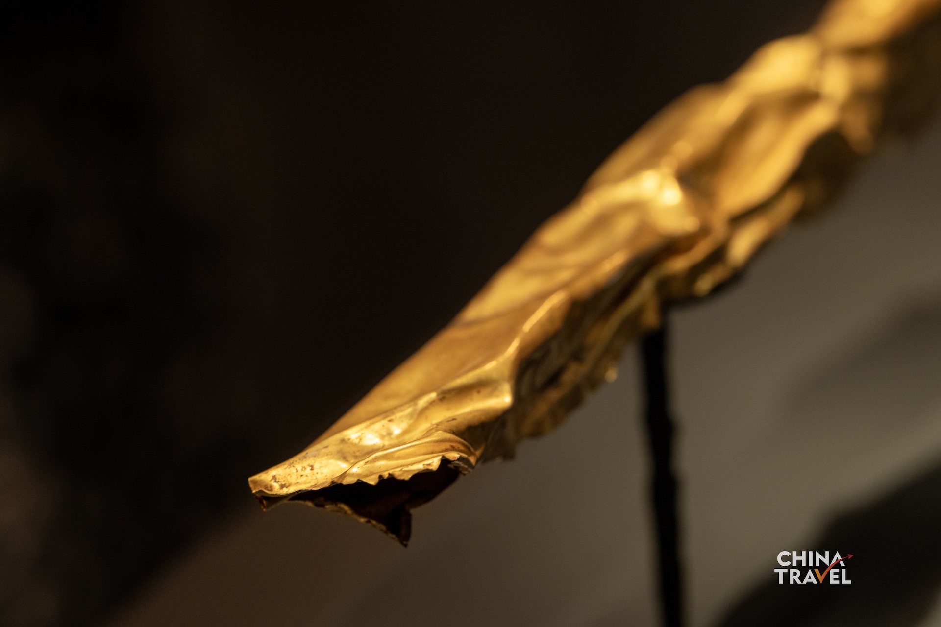 Sanxingdui's gold scepter is decorated with images of fish, birds, arrows and human figures. Its gold foil is believed to have once covered a wooden core. /CGTN