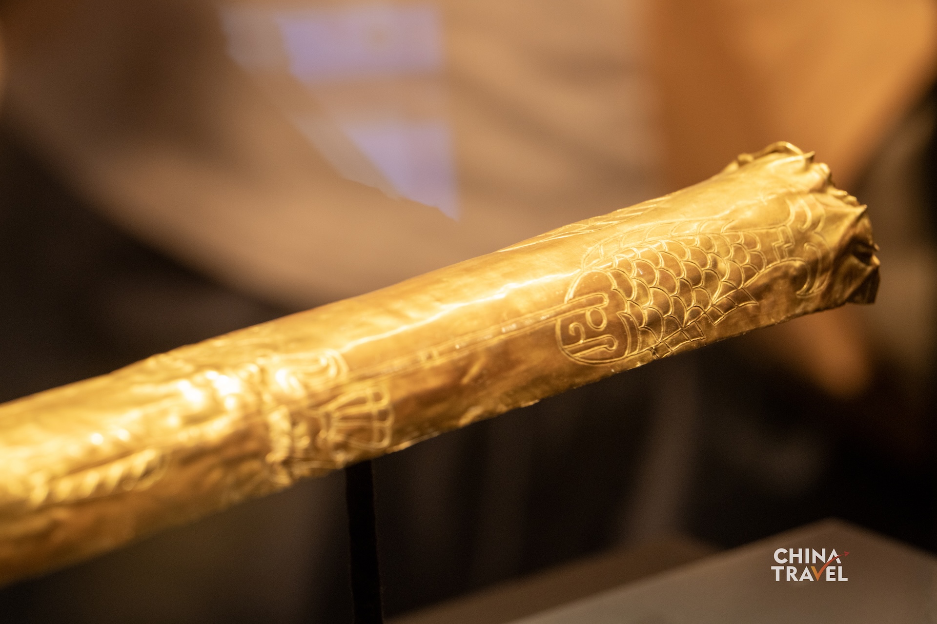 Sanxingdui's gold scepter is decorated with images of fish, birds, arrows and human figures. Its gold foil is believed to have once covered a wooden core. /CGTN