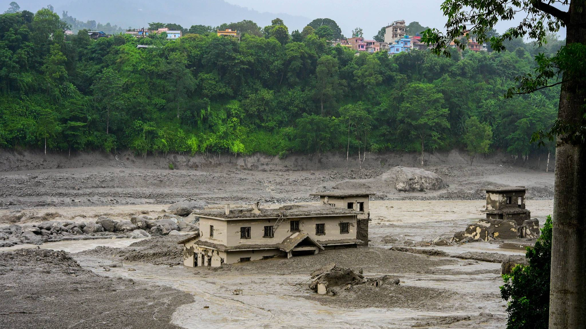 165 killed, 823 missing in Nepal's floods, government agency says