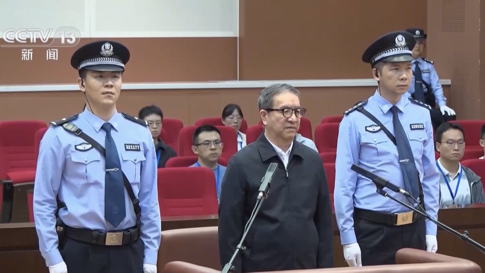 Jiang Chaoliang (C), previously a senior national legislator and Party chief of central China's Hubei Province, stands in court during the trial, Nanjing City, east China's Jiangsu Province, August 28, 2026. /CMG