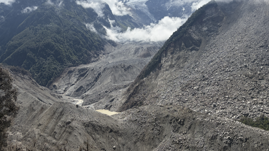 Photo: Barrier lake forms after mudslide hits China's Xizang