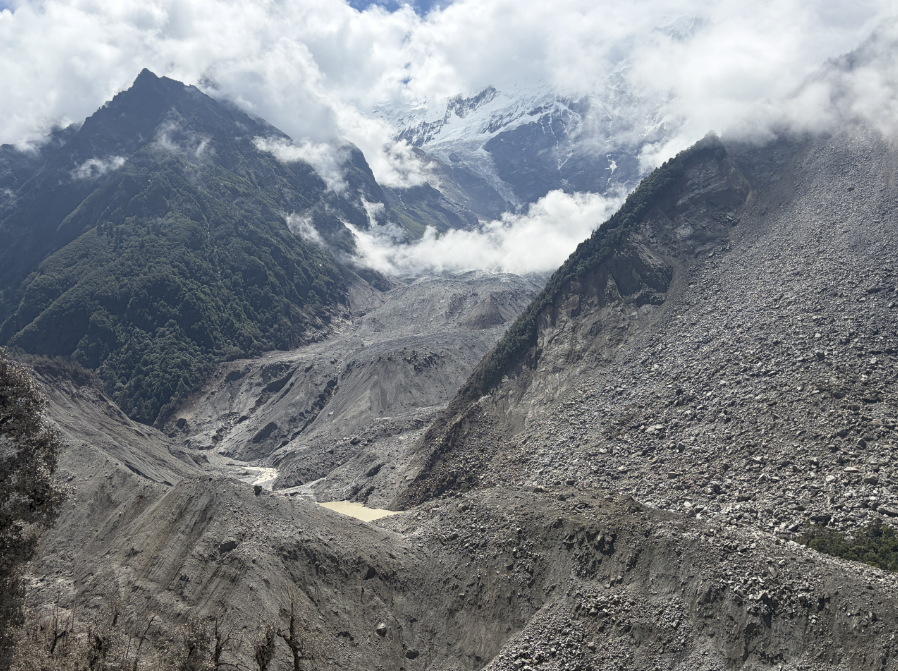 Photo: Barrier lake forms after mudslide hits China's Xizang
