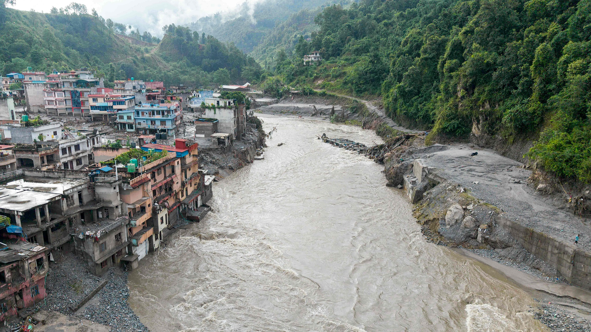 An aerial view of houses lying deluged in sludge after a flash flood in Nuwakot, Nepal, August 27, 2026. /VCG