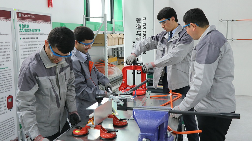 Students operate equipment at a training center inside a Luban Workshop in Dushanbe, Tajikistan, April 17, 2023. /VCG