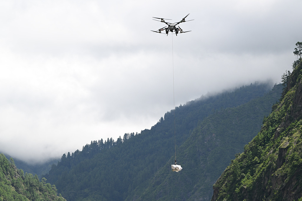 Rescue workers use drones to deliver supplies, Gyirong Port, southwest China's Xizang Autonomous Region, August 28, 2026. /VCG