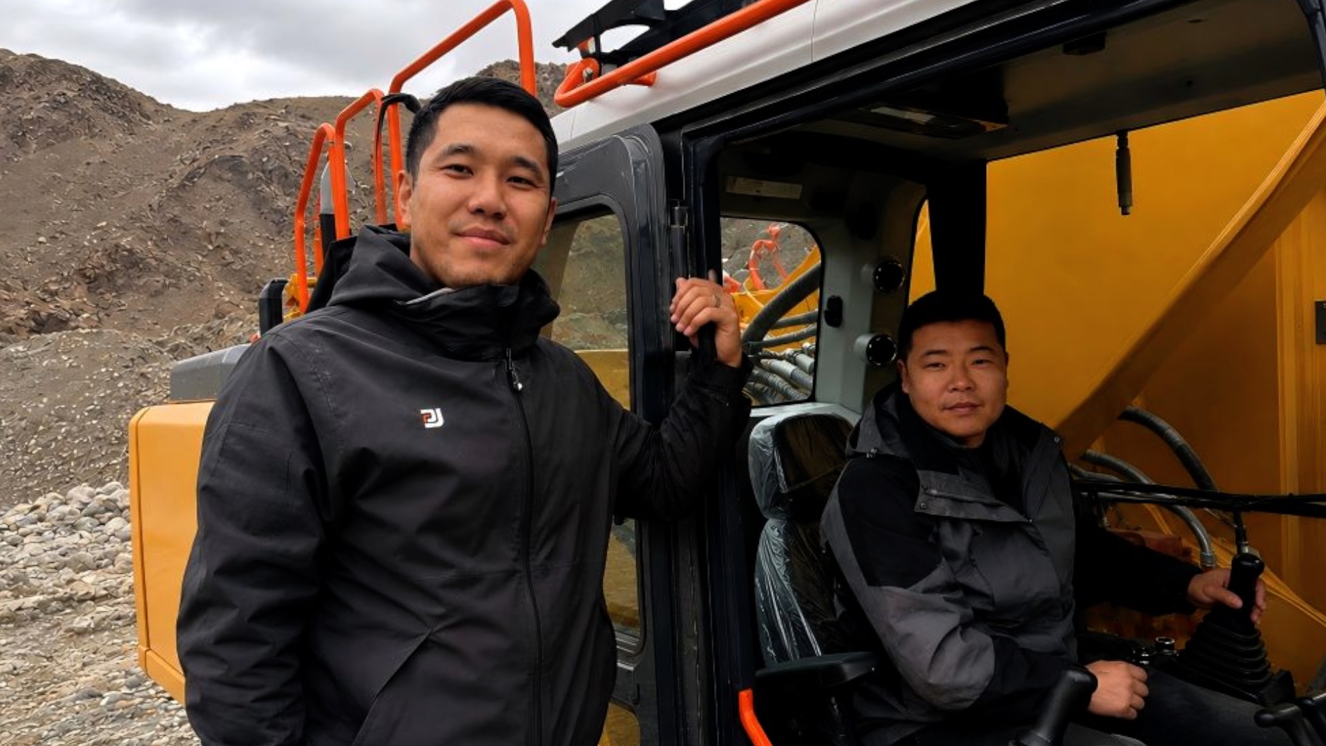 Kyrgyzstan's local worker Marsel Chokoev (L) and his Chinese colleague in the China-Kyrgyzstan-Uzbekistan railway project, July 5, 2026. /Xinhua