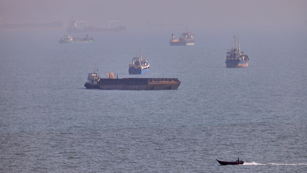Commercial vessels seen anchored in the Strait of Hormuz off Bandar Abbas, Iran, August 5, 2026. /VCG