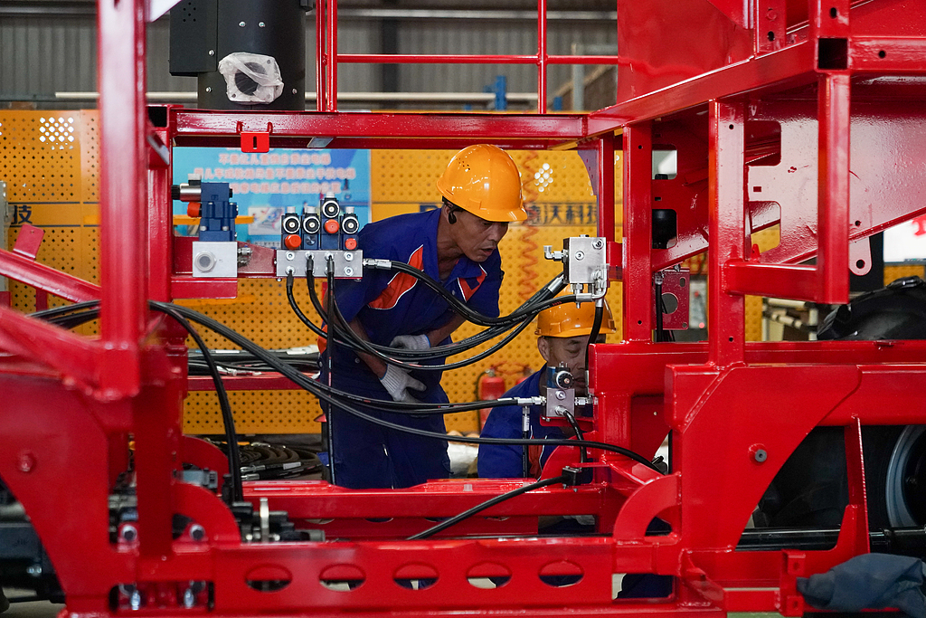 A worker assembles agricultural machinery at Heilongjiang Dewo Technology Development Co., Ltd. in Harbin, Heilongjiang Province, China, September 1, 2026. /VCG