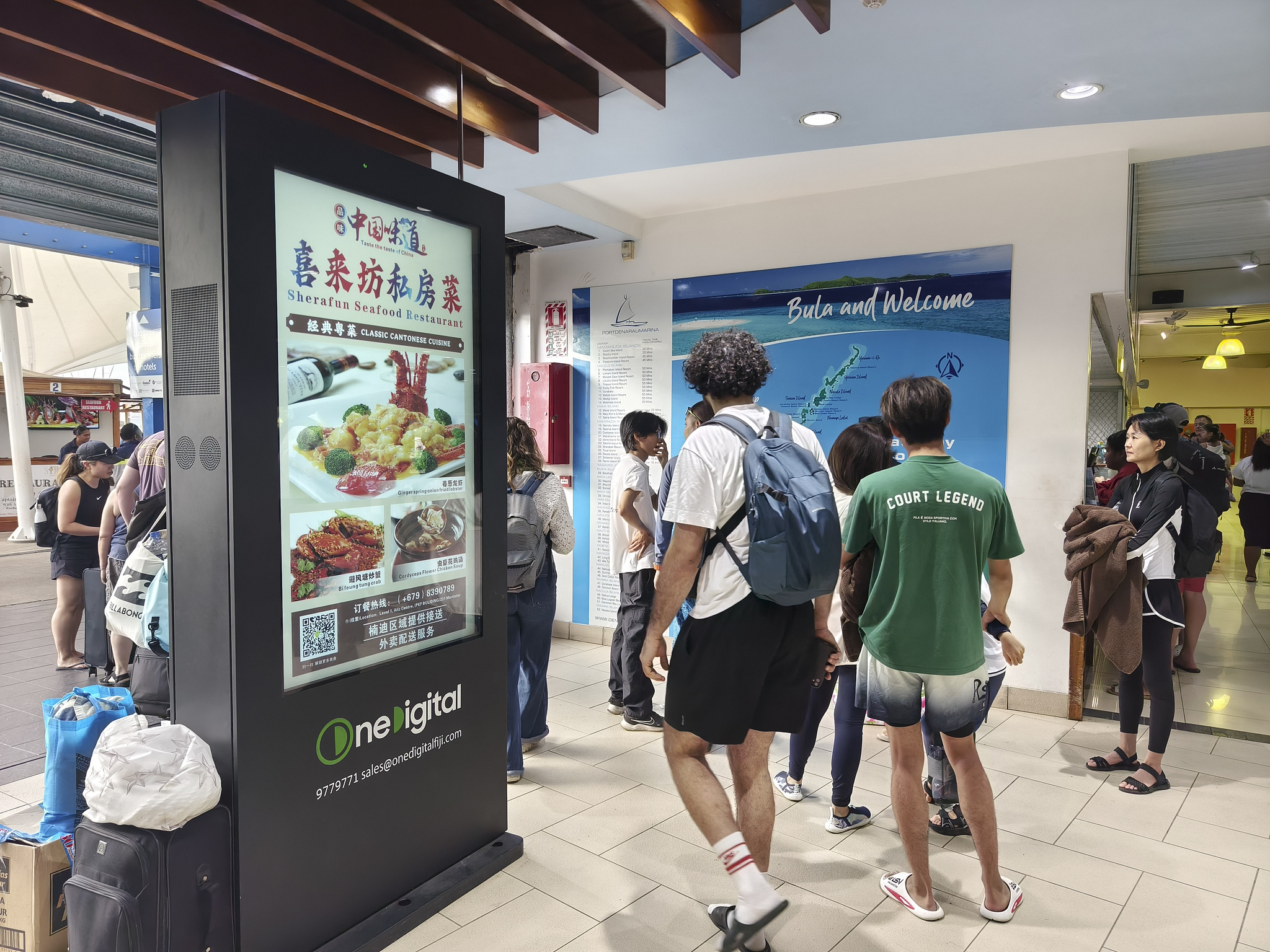 Advertisements for Chinese restaurants were displayed at the ticket office at the port of Fiji's main island, July 25, 2024. /CFP