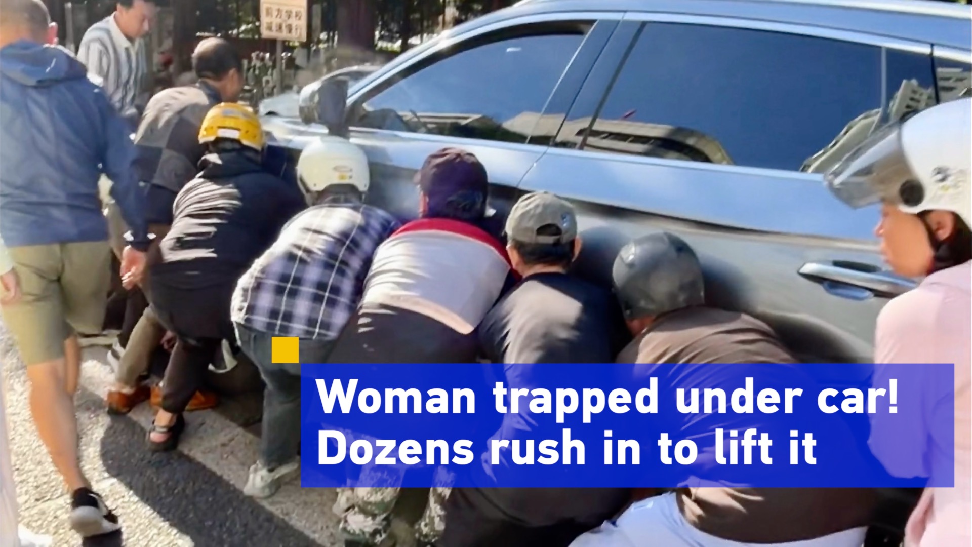 Woman trapped under car! Dozens rush in to lift it