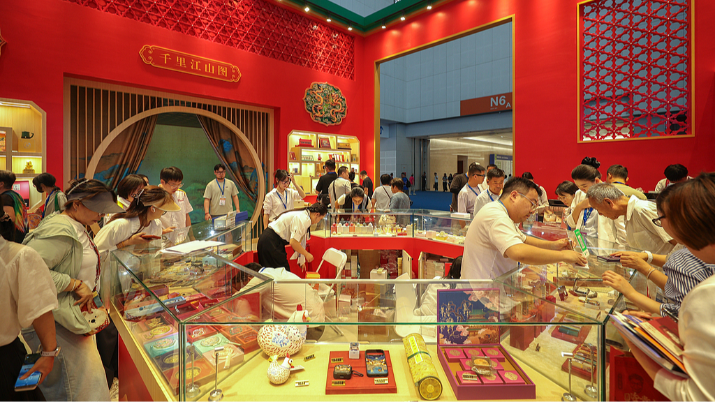 Visitors browse products at the Palace Museum booth at the 2026 China Culture and Tourism Industries Expo on September 3, 2026, in Tianjin. /VCG