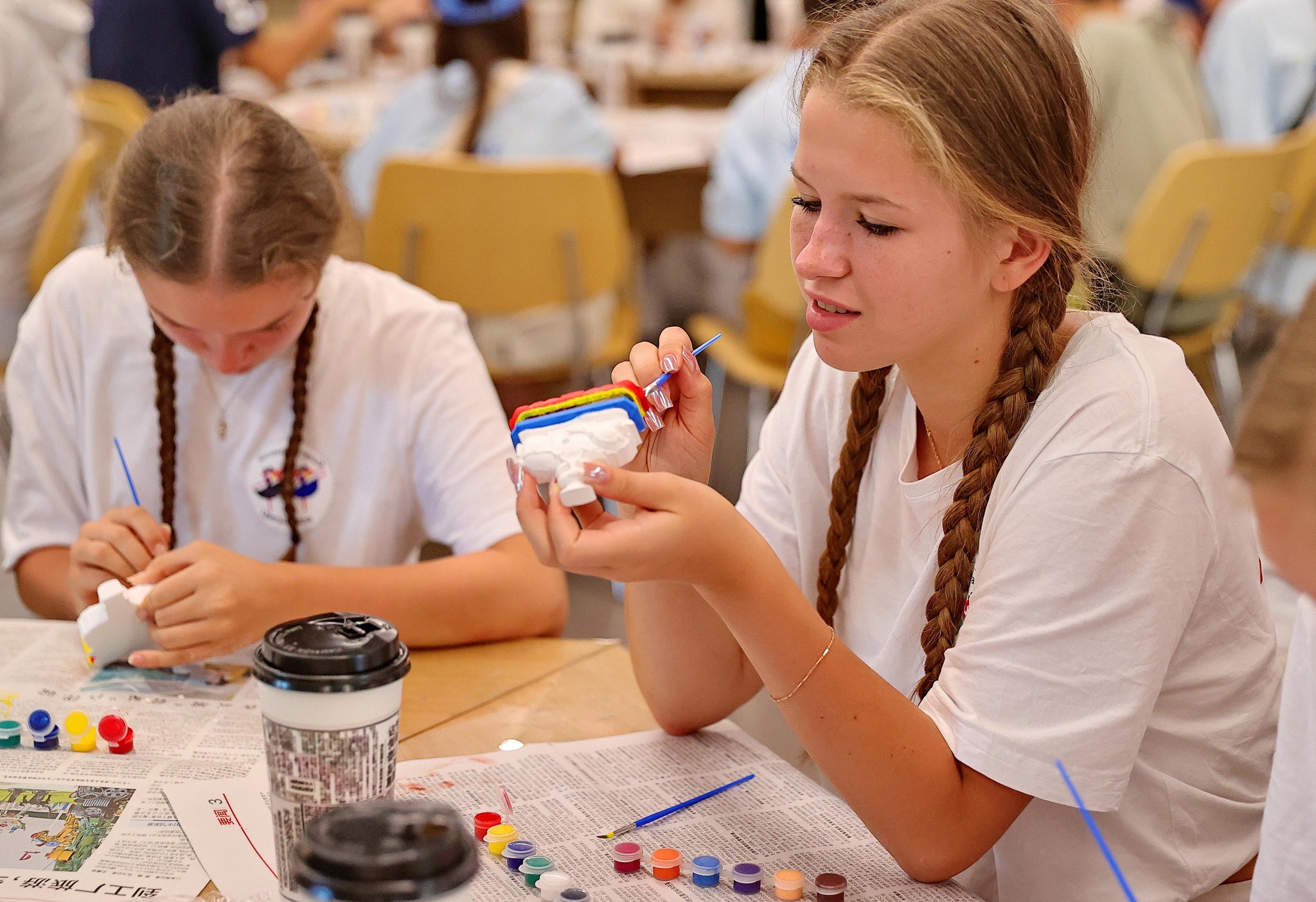 Russian teenagers paint plaster crafts at the Qinhuangdao Museum in north China's Hebei Province on September 3, 2026. /VCG