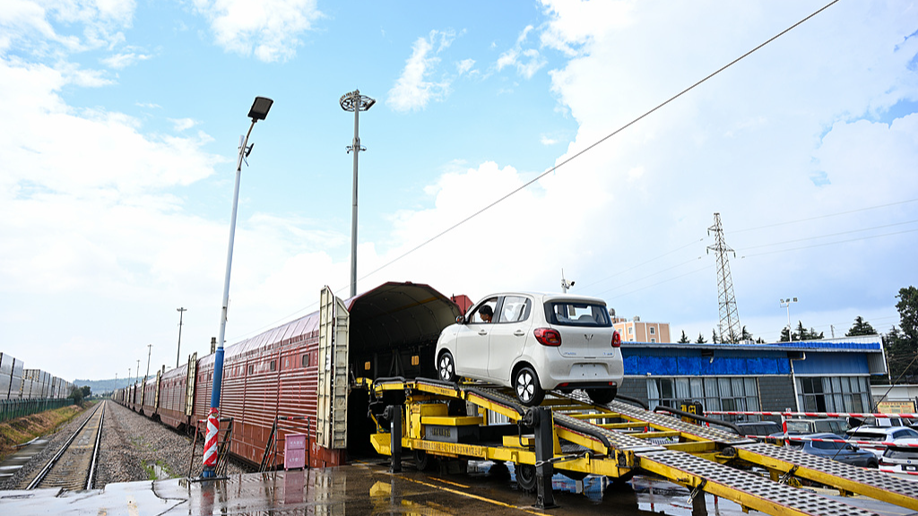 Commodity vehicles are parked in neat rows, ready to be loaded onto a China-Laos Railway train in Yuxi, Yunnan Province, China, August 28, 2026. /VCG