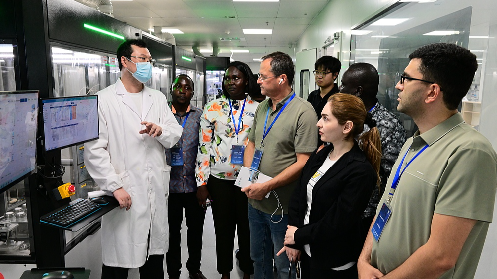 Participants from the Belt and Road Seminar on Governance Capacity Building visit the Jinhua Research Institute of Zhejiang Chinese Medical University in Jinhua, Zhejiang Province, China, July 6, 2026. /VCG