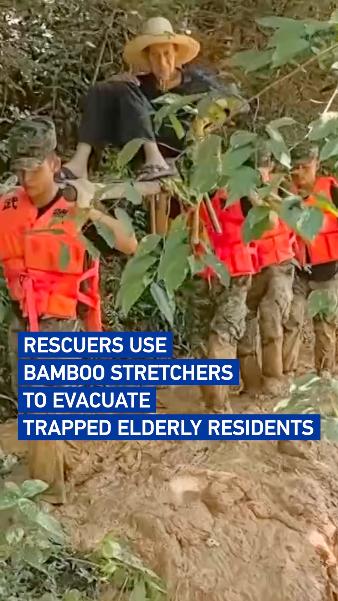 Rescuers use bamboo stretchers to evacuate trapped elderly residents