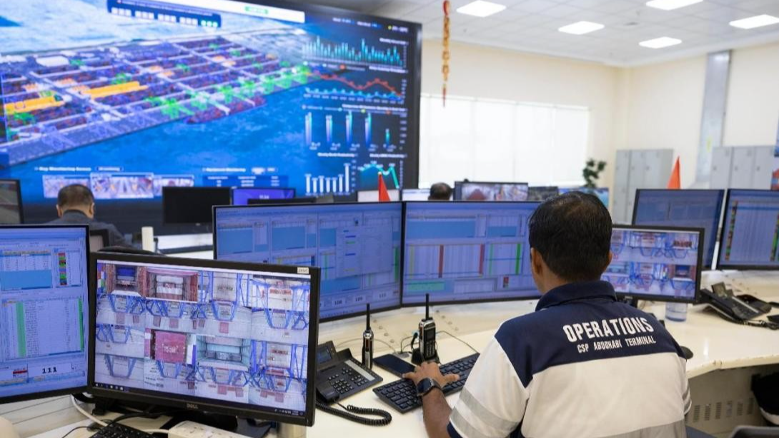 Staff members track operations through a digital twin system in the control room of the COSCO Shipping Ports Abu Dhabi Terminal. /People's Daily
