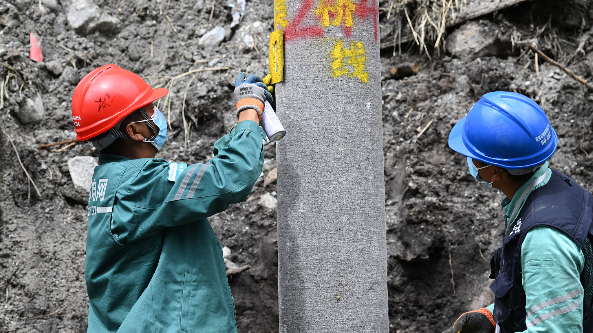 State Grid workers carry out work at the hardest-hit area of Gyirong Port in southwest China's Xizang Autonomous Region, September 4, 2026. /VCG