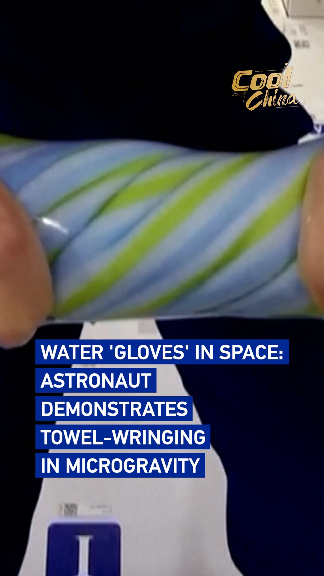 Astronaut demonstrates towel-wringing in microgravity