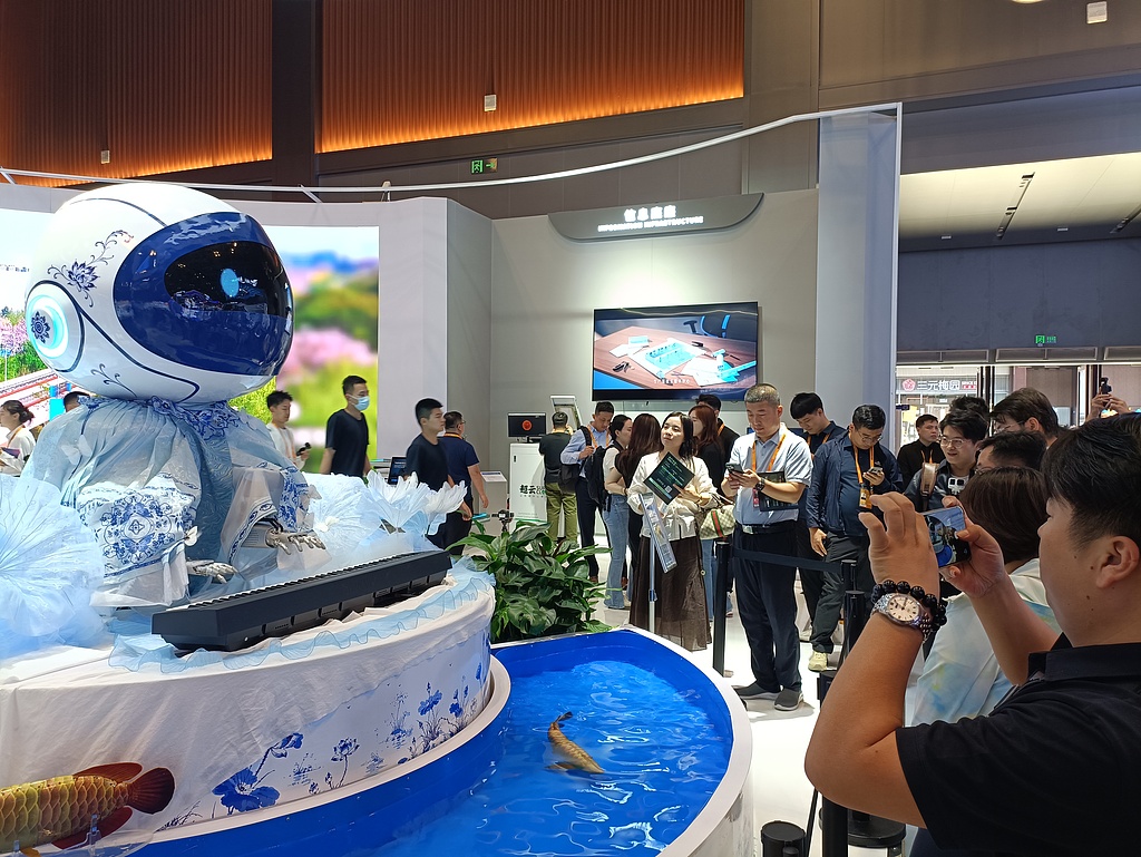 A robot developed by MirrorMe Technology plays a keyboard at the Telecommunications, Computer and Information Services Exhibition during the 2026 CIFTIS at Shougang Park in Beijing, China, September 9, 2026. /VCG