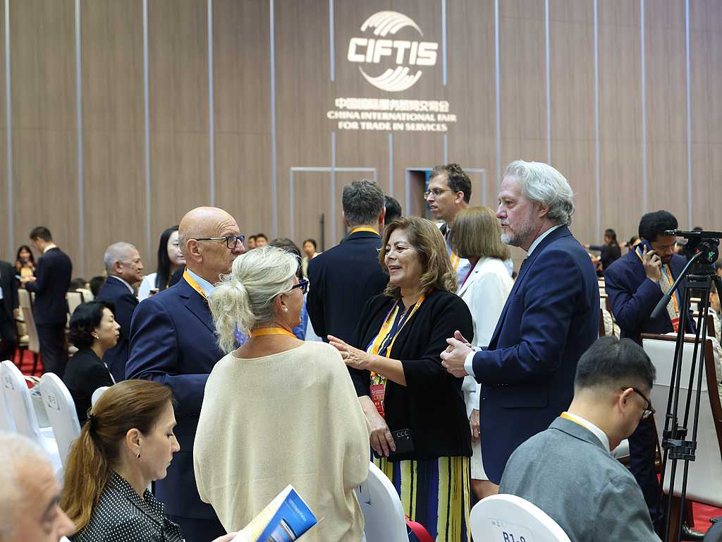 Attendees talk ahead of the Global Trade in Services Summit of the 2026 CIFTIS at Shougang Park in Beijing, China, September 9, 2026. /China News Service/Jiang Qiming
