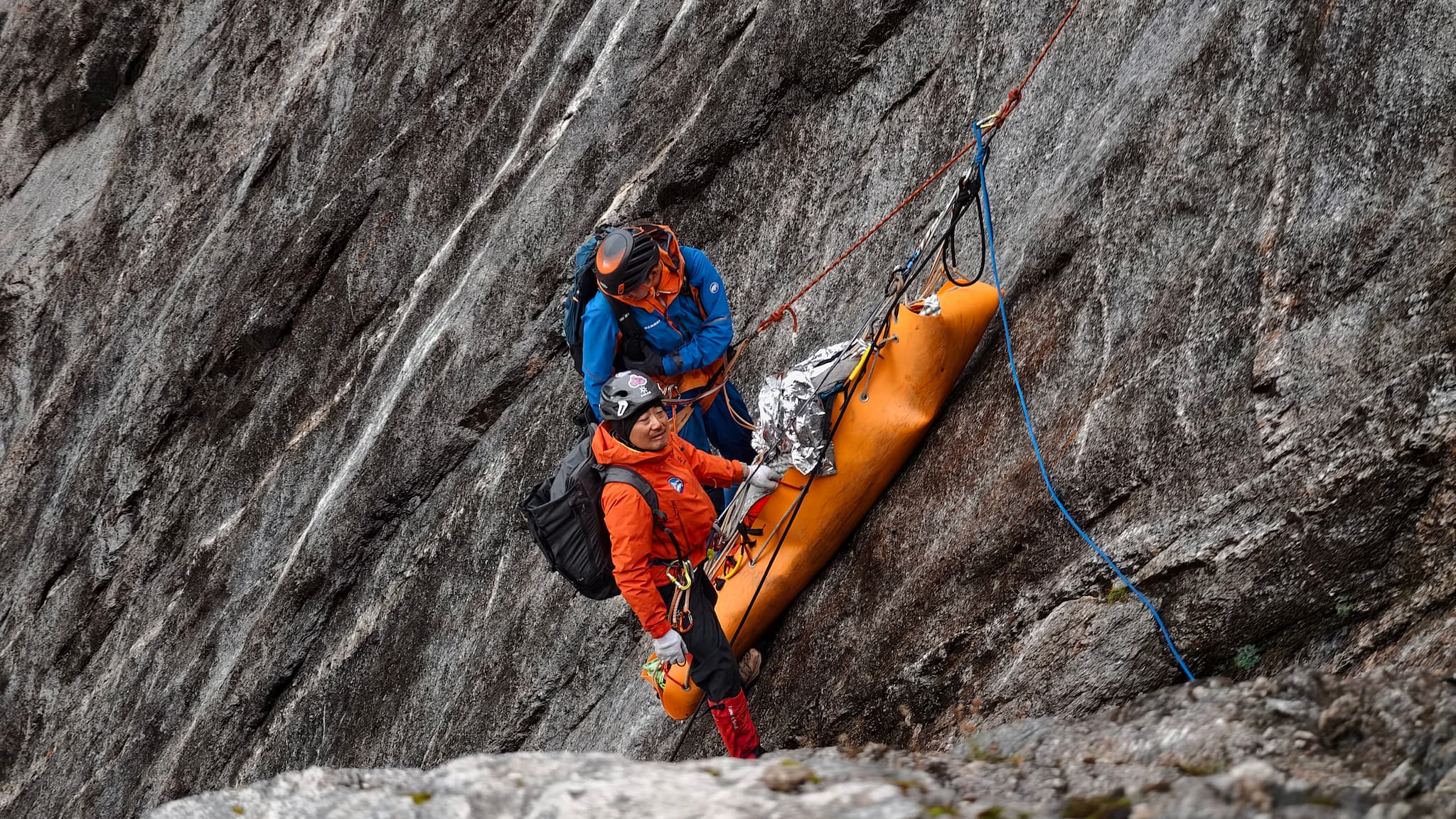 Members of the Xiaojin County Red Cross Mountain Rescue Team carry an injured climber down Siguniang Mountain in Xiaojin County, Sichuan Province, September 7, 2025./Courtesy of Yu Qiang