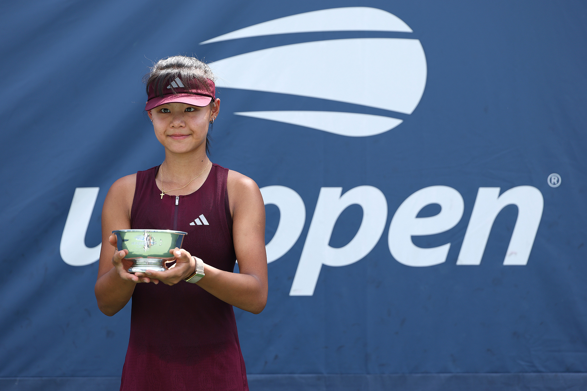 Sun Xinran of China celebrates with the trophy after defeating Anna Pushkareva in their girls' singles final match during the US Open at USTA Billie Jean King National Tennis Center in New York City, US, September 12, 2026. /VCG