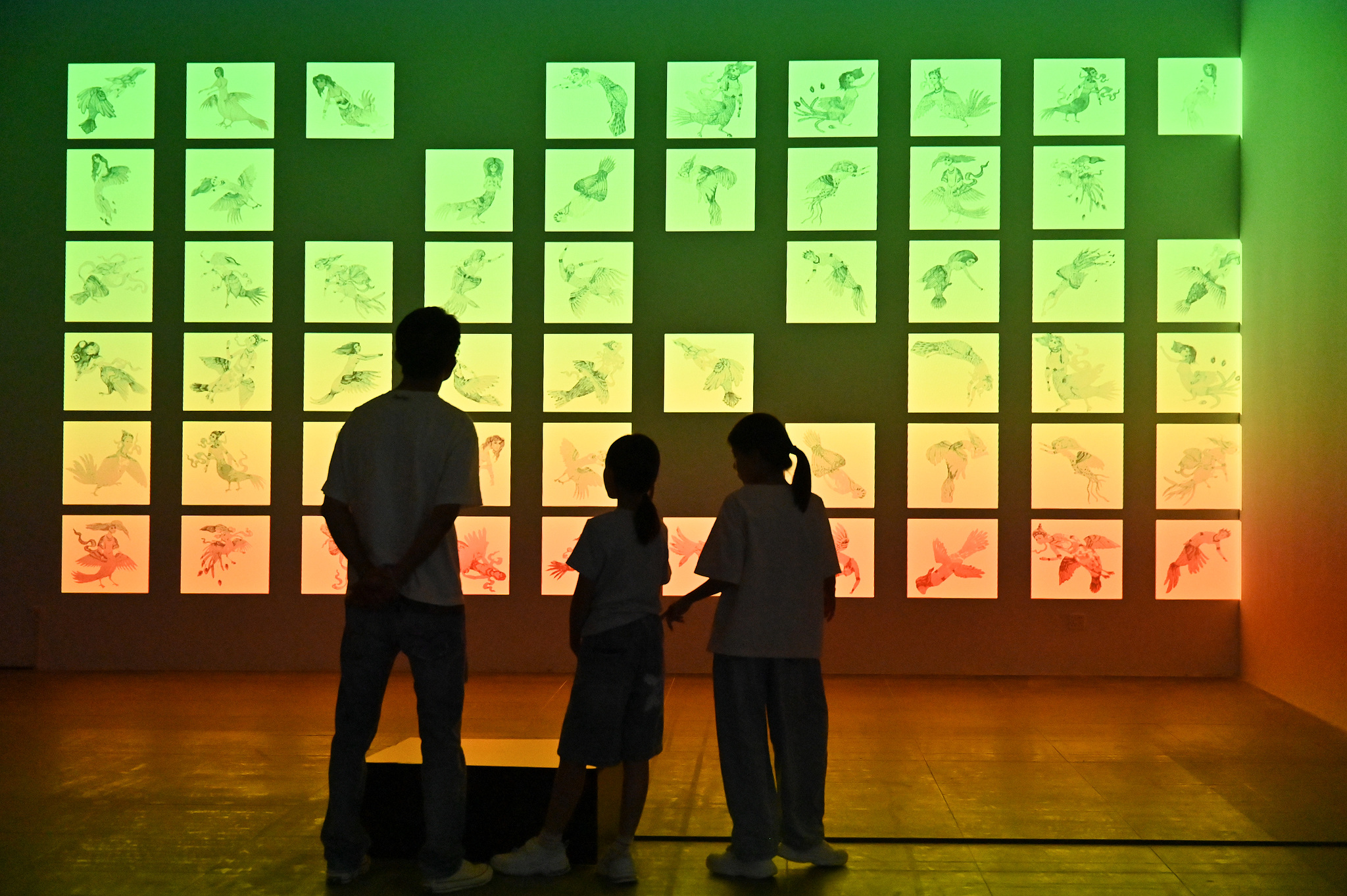 Visitors appreciate an exhibit at the 12th Euro-Asian Mediations Digital Art Biennale in Guangzhou, Guangdong Province, on September 13, 2026. /VCG