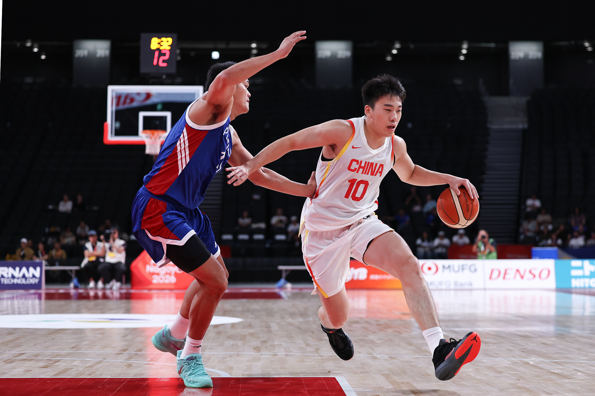 China's Wang Junjie (#10) drives toward the basket in the Group C game against the Philippines at the 2026 Aichi-Nagoya Asian Games in Nagoya, Japan, September 14, 2026. /VCG