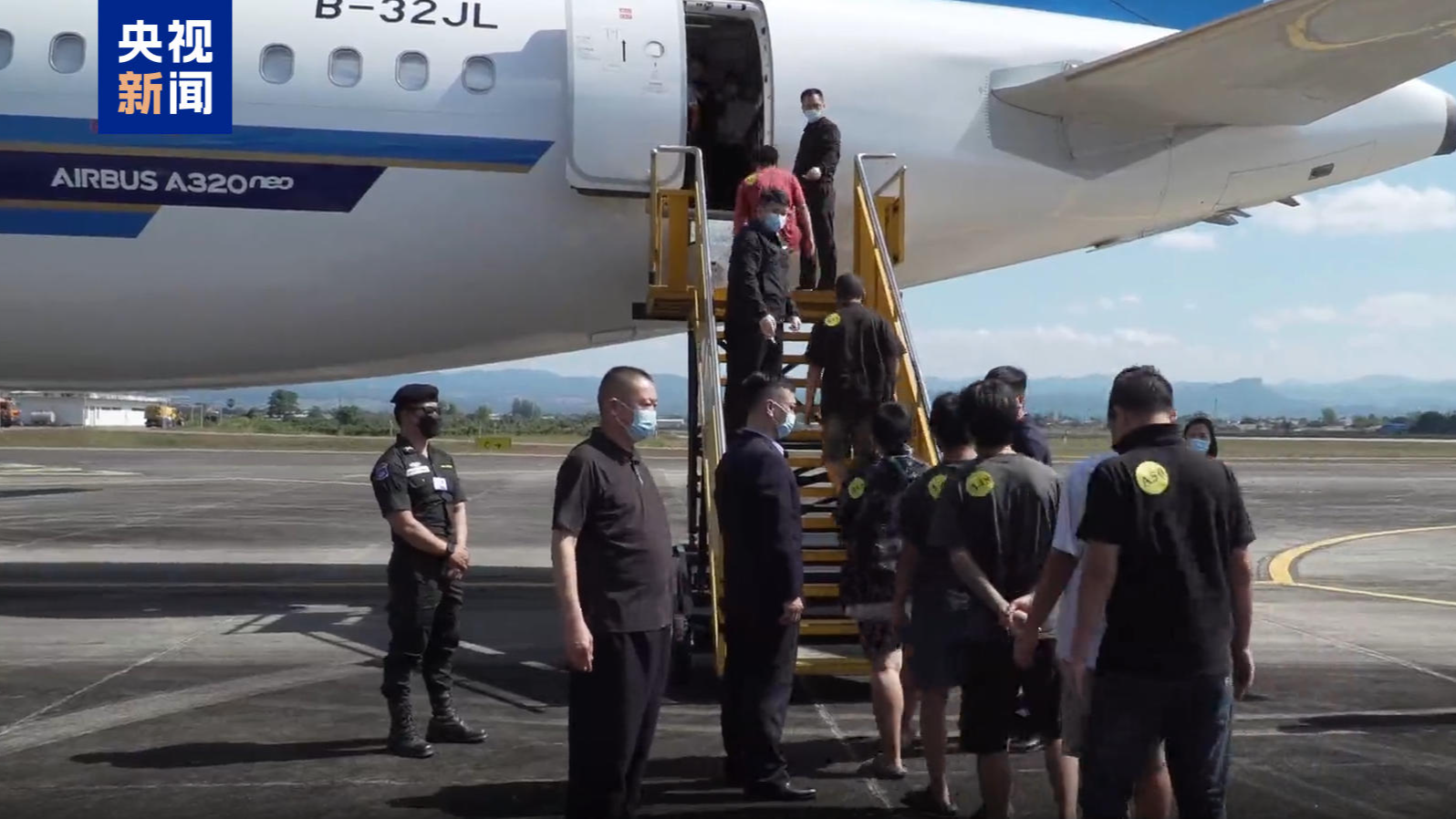 Suspects are escorted back to China, following a joint China-Myanmar-Thailand operation on striking gambling and telecom fraud zones in Myanmar's Myawaddy region in December 2025, with 952 individuals extradited. /CMG