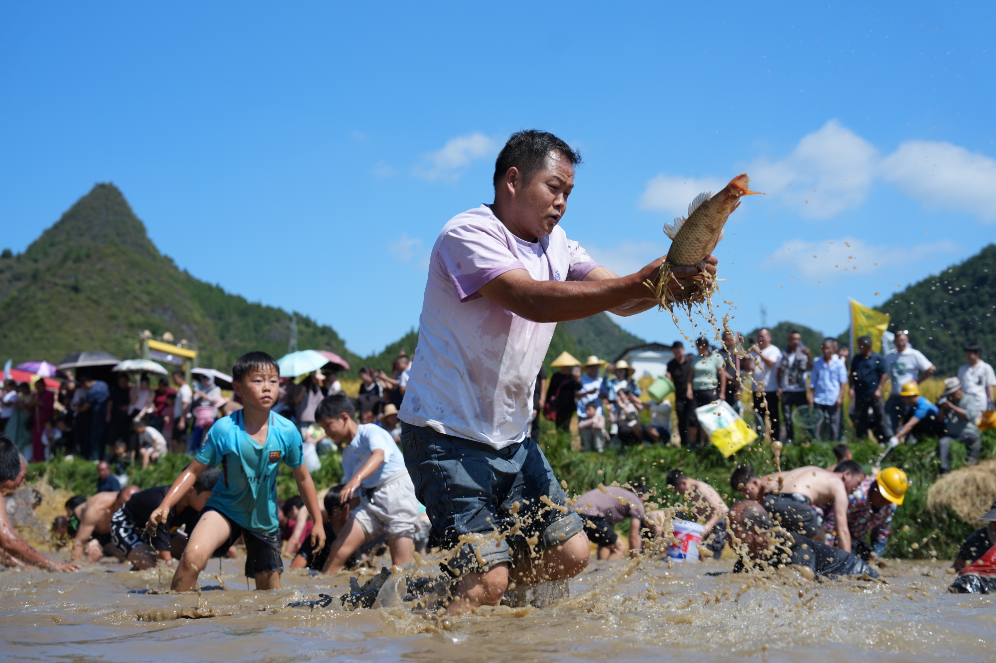 The 9th annual rice harvest opening ceremony of Guojiawan Village is held in Yuping Dong Autonomous County, southwest China's Guizhou Province on September 12, 2026. /Tongren Media Convergence Center