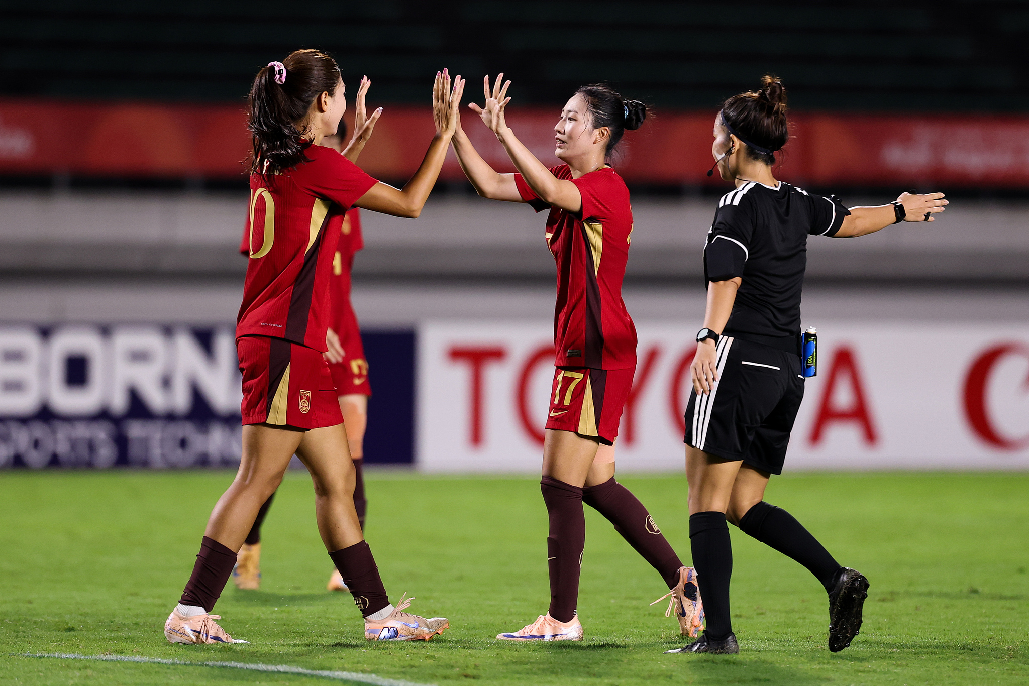 China's players celebrate after scoring a goal in the Group G match against China’s Hong Kong Special Administrative Region (HKSAR) at the 2026 Aichi-Nagoya Asian Games in Gifu, Japan, September 14, 2026. /VCG