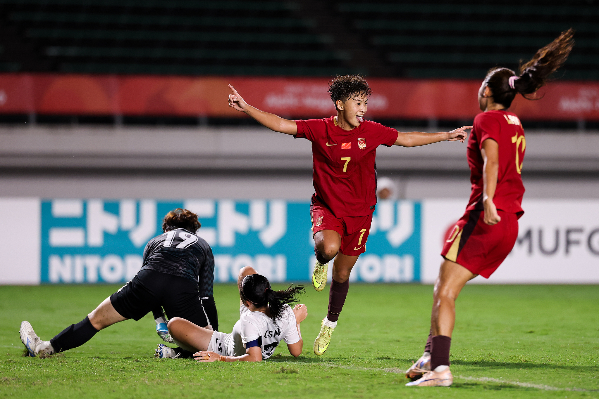 China's players celebrate after scoring a goal in the Group G match against China’s Hong Kong Special Administrative Region (HKSAR) at the 2026 Aichi-Nagoya Asian Games in Gifu, Japan, September 14, 2026. /VCG