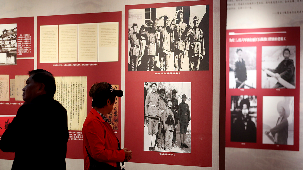Visitors view an exhibition featuring archival documents and photographs about the Red Army's Long March through Yunnan Province at the Kunming Museum in Kunming, southwest China's Yunnan Province, September 12, 2026. /VCG