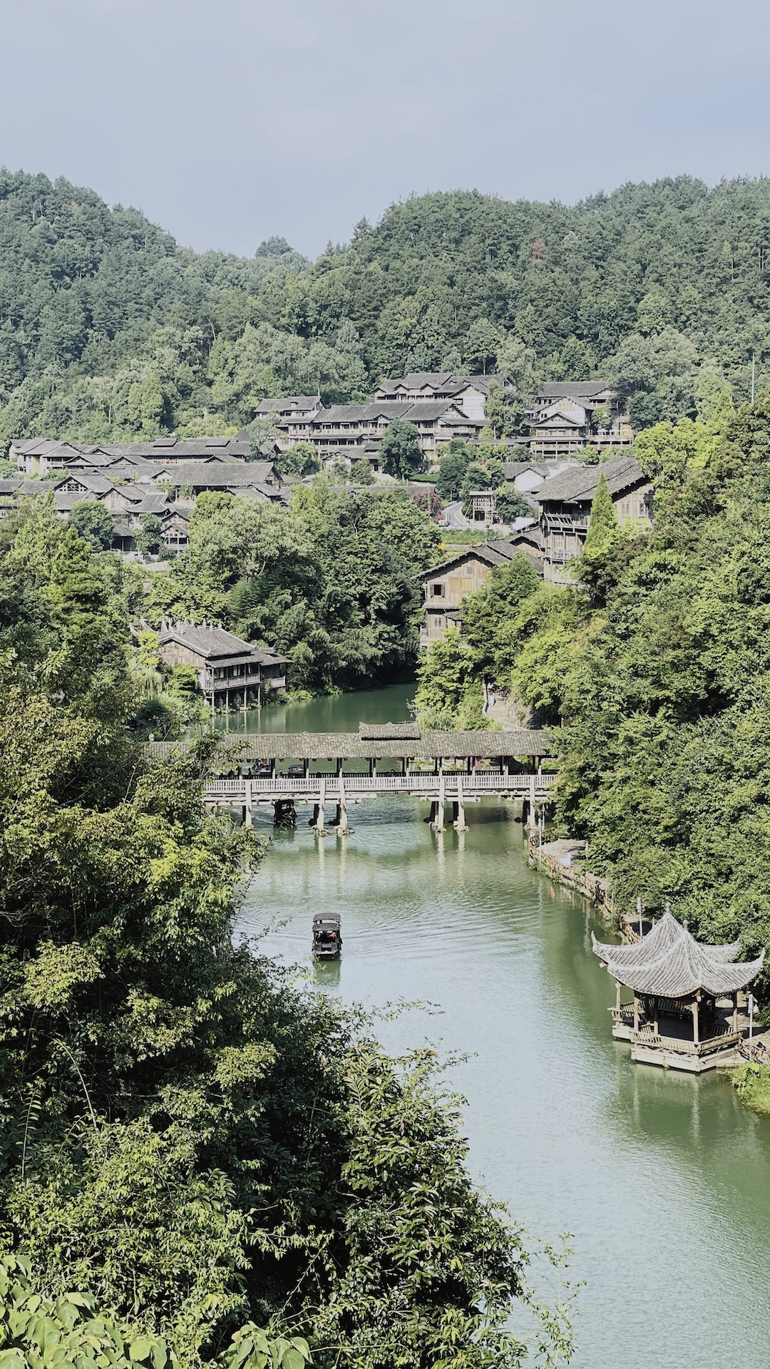 A bridge spans the Wujiang River amid the mountains in Guizhou, China. /CGTN