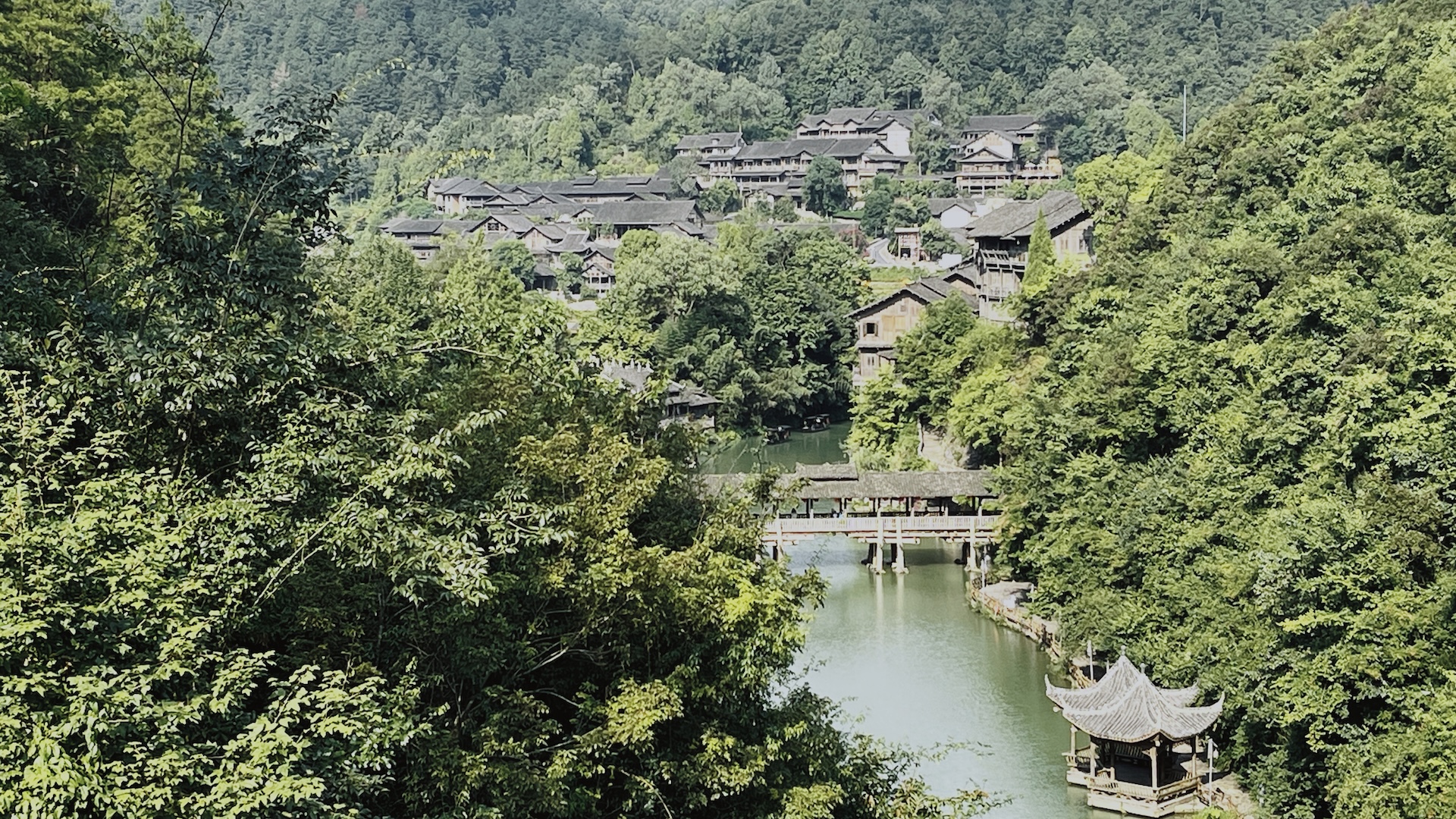 A bridge spans the Wujiang River amid the mountains in Guizhou, China. /CGTN