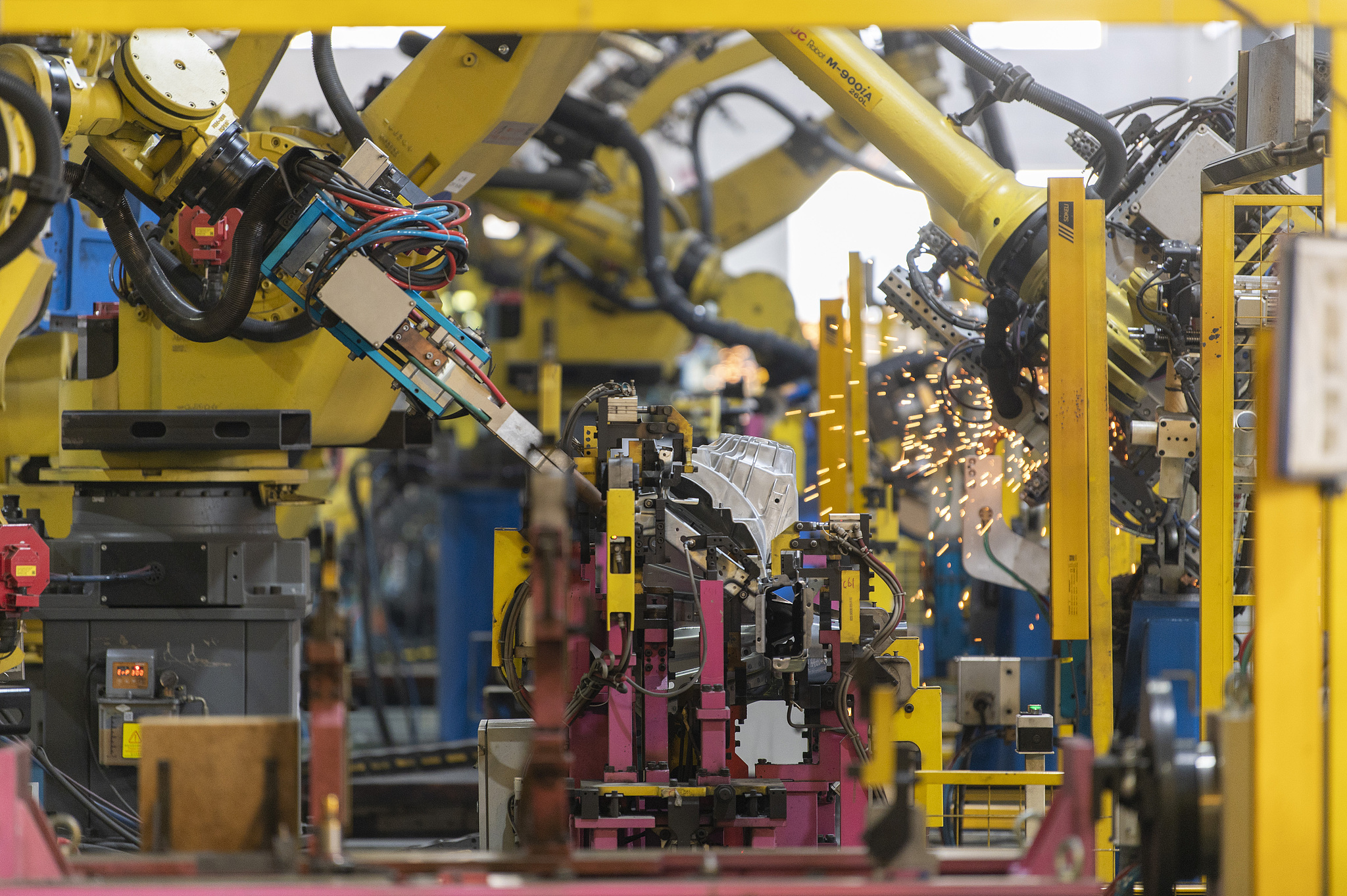 Inside an intelligent workshop, industrial robots were operating at high speed as new energy vehicle components rolled off the production line in Jinhua, Zhejiang Province, China, on September 15, 2026. /VCG