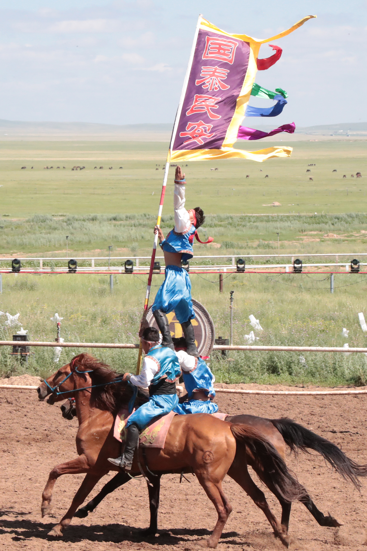 Performers showcase equestrian acrobatics during 