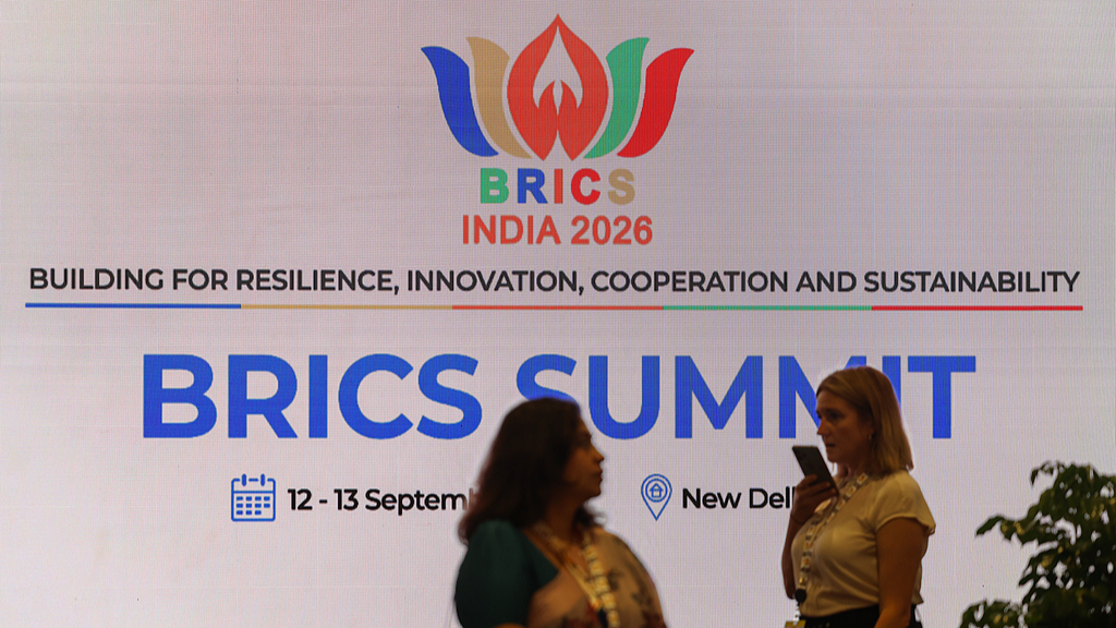 People walk past BRICS signage at Bharat Mandapam, the venue for the BRICS Summit 2026, in New Delhi, India, September 12, 2026. /VCG