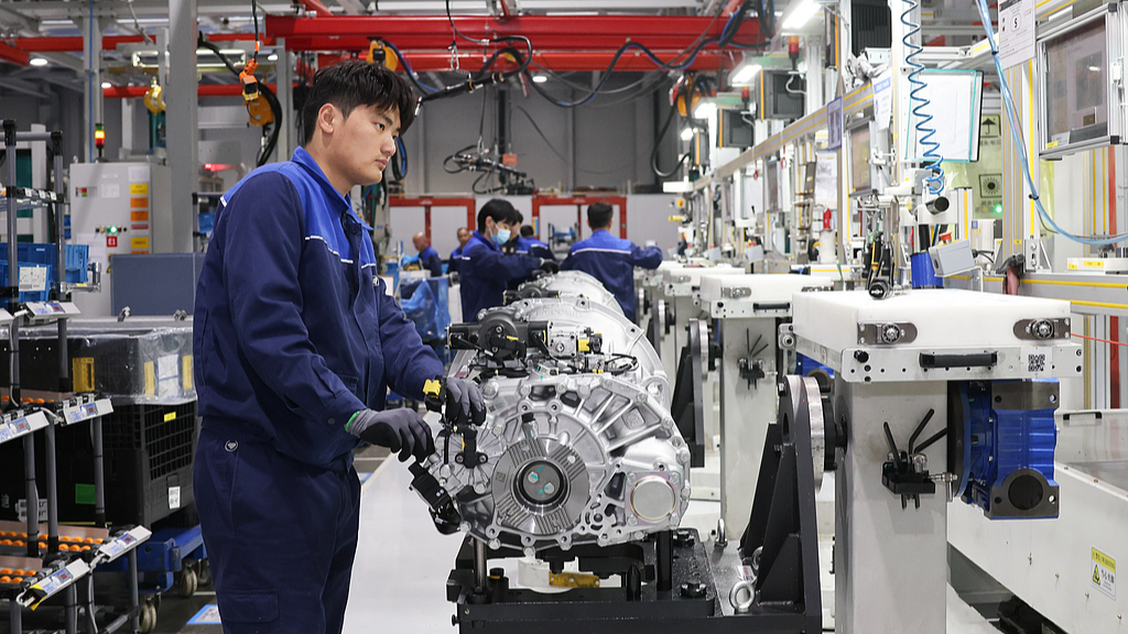 Workers operate machines at a production line in a joint-venture factory at the advanced manufacturing base in the Jiaxing Economic and Technological Development Zone in Jiaxing, east China's Zhejiang Province, April 3, 2026. /VCG