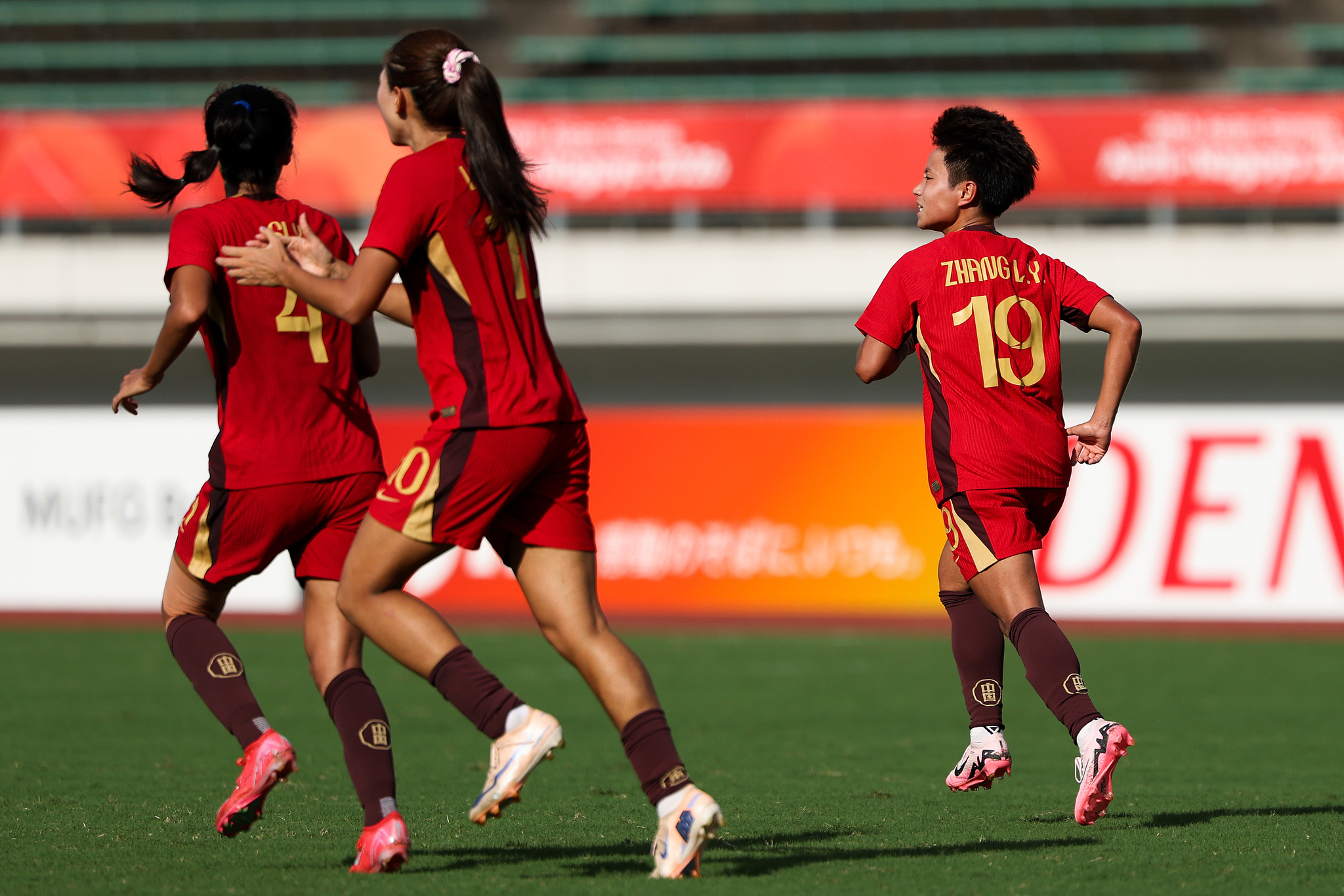 China players celebrate after scoring in their Group G match against Uzbekistan at the 2026 Aichi-Nagoya Asian Games in Gifu, Japan, September 17, 2026. /VCG