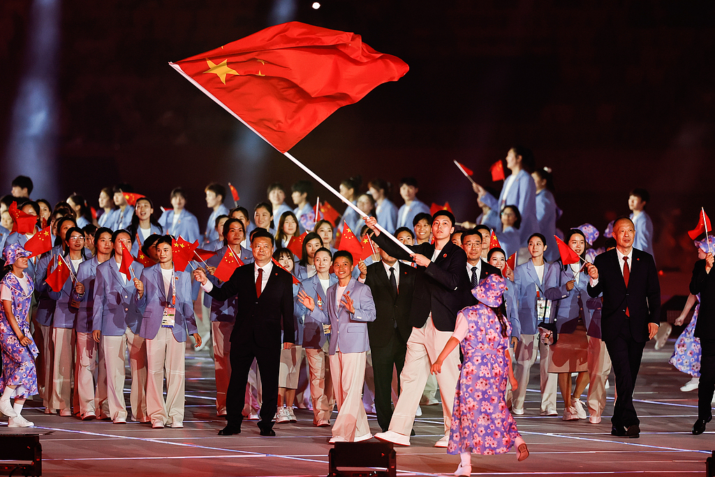 Team China, led by two flag bearers, enters the court at the opening ceremony of the 2026 Asian Games, Japan, September 19, 2026. /CFP