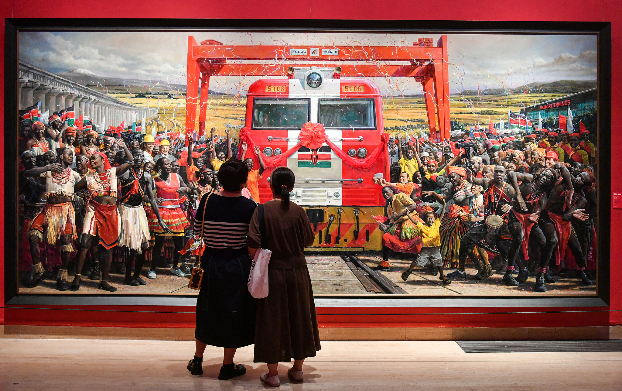 Visitors at the National Art Museum of China view the artwork 