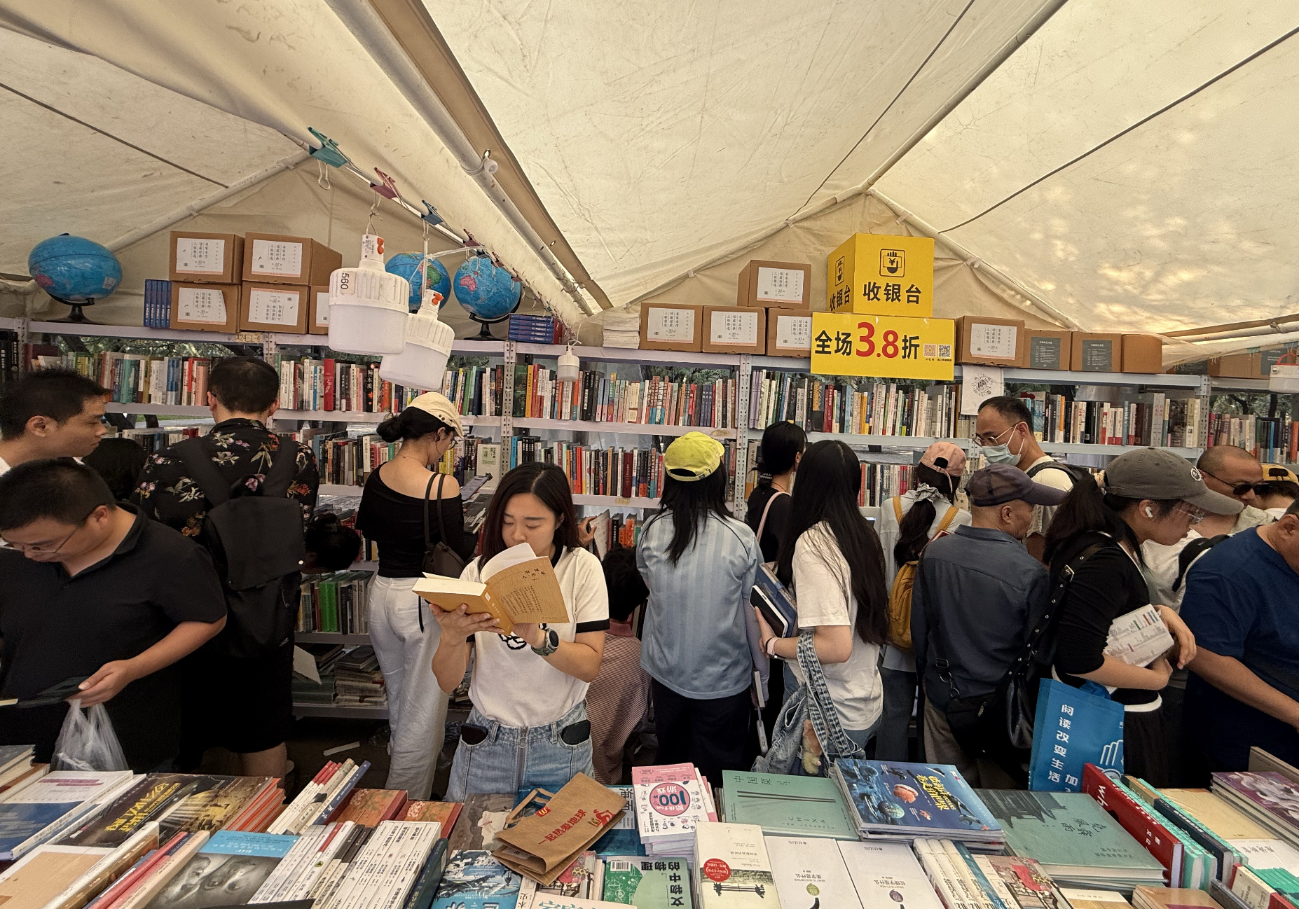 Visitors browsing through numerous books at the Ditan Book Fair 2026, September 19, 2026, Zaruhi Poghosyan /CGTN