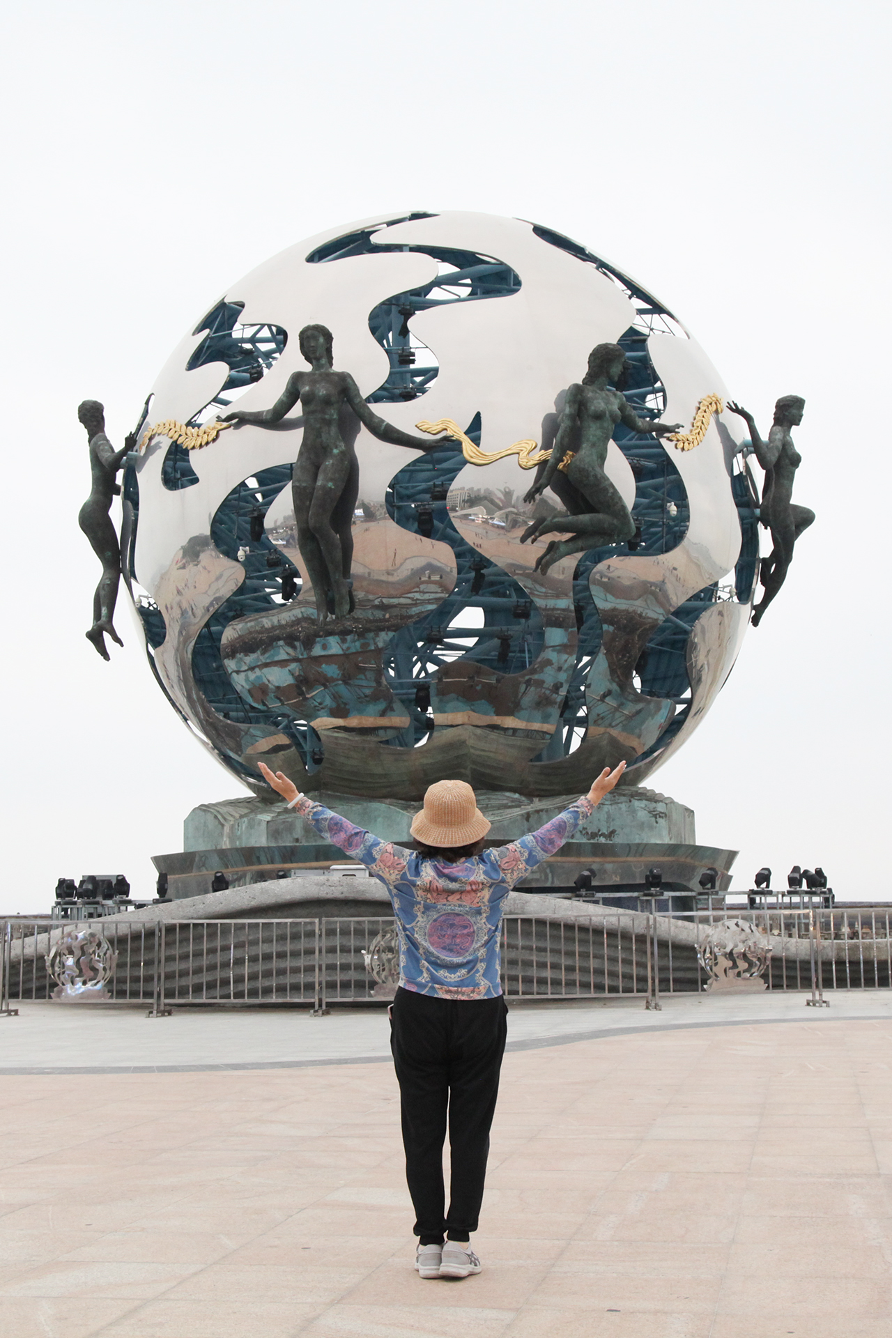 A tourist poses for photos with the 