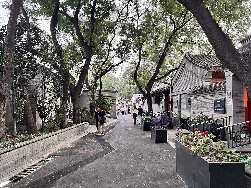 Visitors explore the Fayuan Temple historic neighborhood in Xicheng District on September 19, 2026. Restored hutongs retain the area's traditional character, with Lanman Hutong drawing crowds as a popular spot for city walks. /VCG